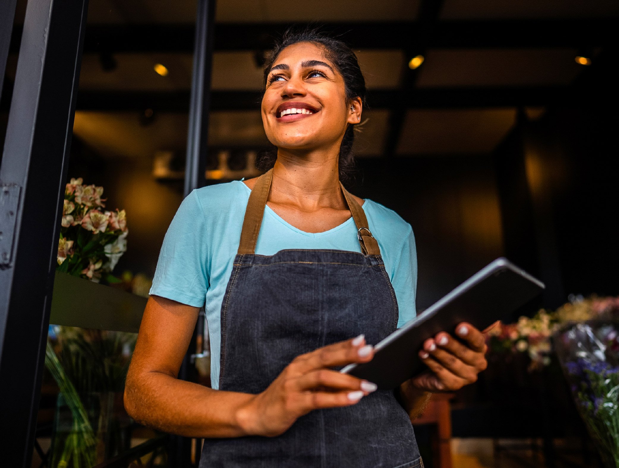 Small business owner managing community marketing via mobile app